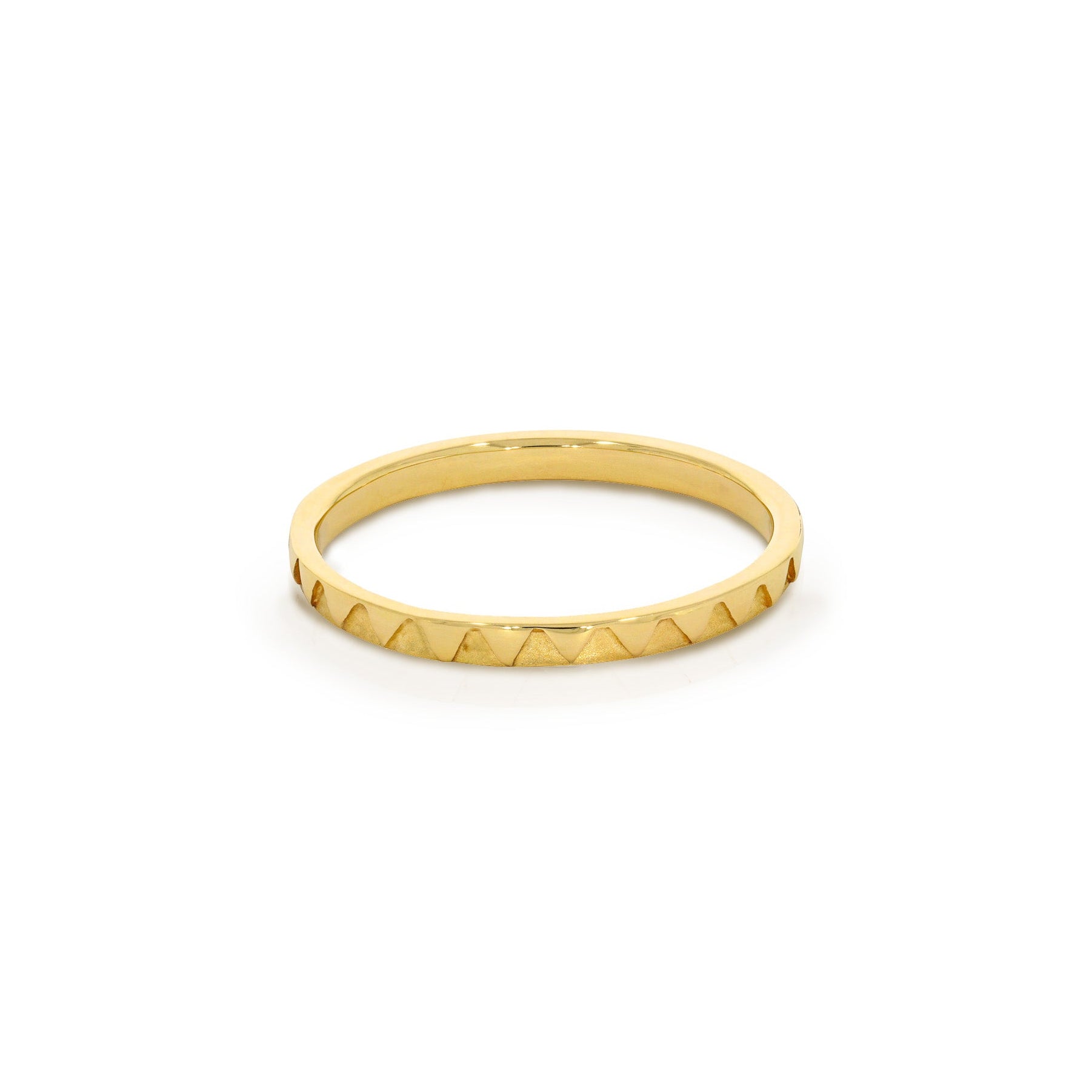 Gold ring with a textured band on a white background