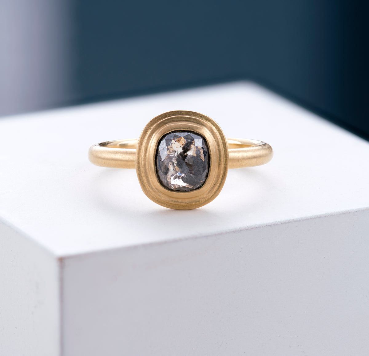 18ct Cushion Cut Diamond Ring shown at an angle on a white background.