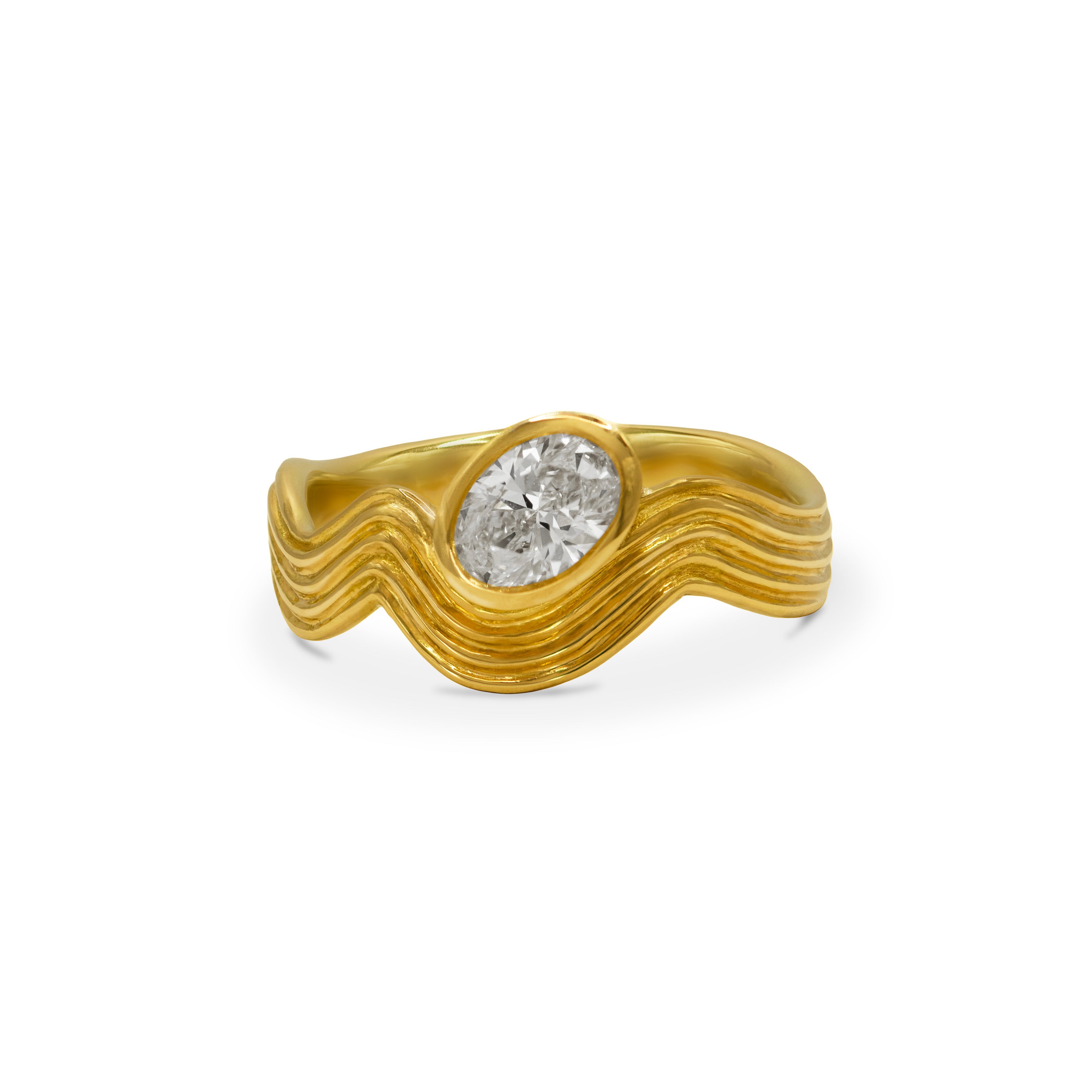 Oval cut diamond bezel-set into an 18ct gold wave ring, shown on a white background.