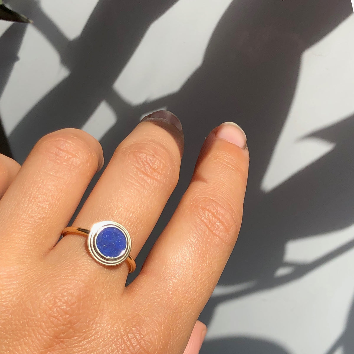 Ascent Gold Ring with Lapis Lazuli Stone worn on a hand