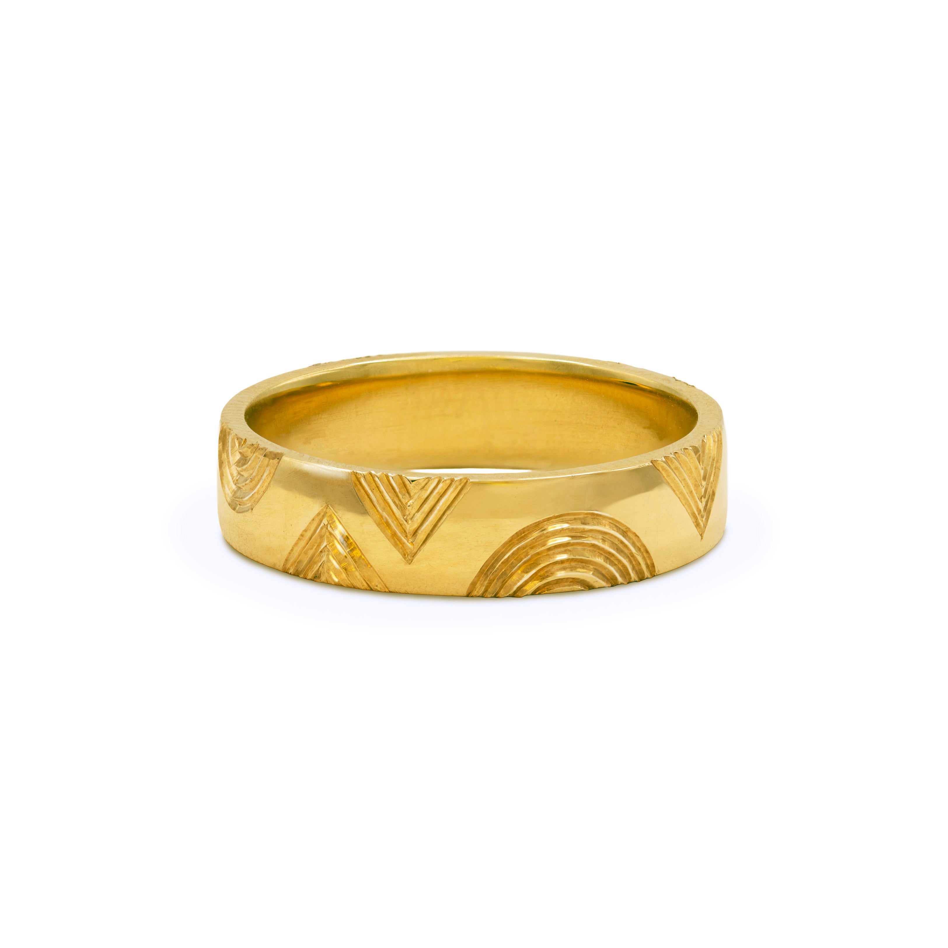 18ct yellow gold wedding ring engraved with a geometric chevron and arc pattern, handmade by Zelda Cave Jewellery