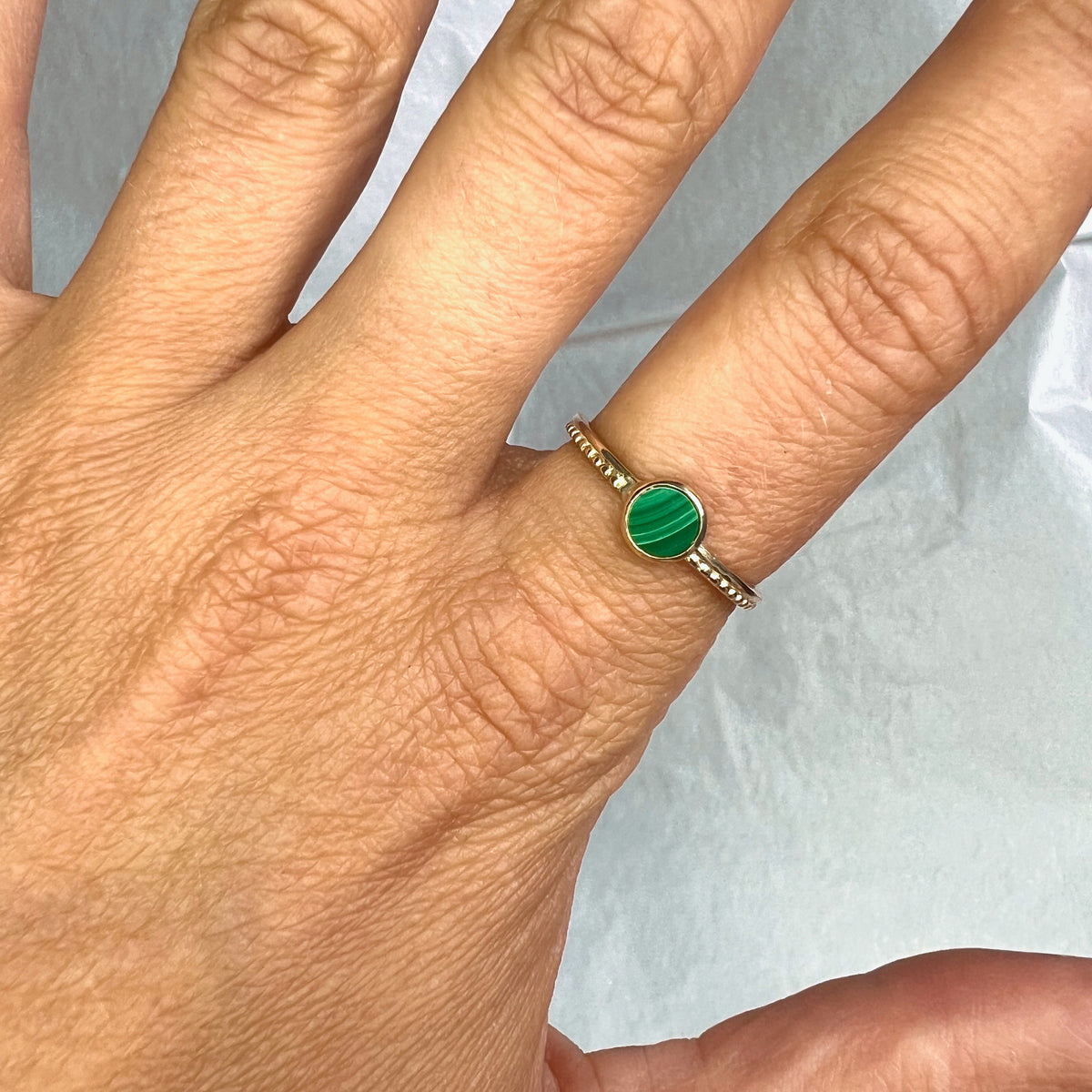 Scintilla Ring with Malachite Stone worn on a hand